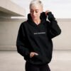 kat-krush-Quiet-confidence-black-hoodie-front-car-park Minimal streetwear black hoodie Quiet Confidence urban aesthetic UK brand