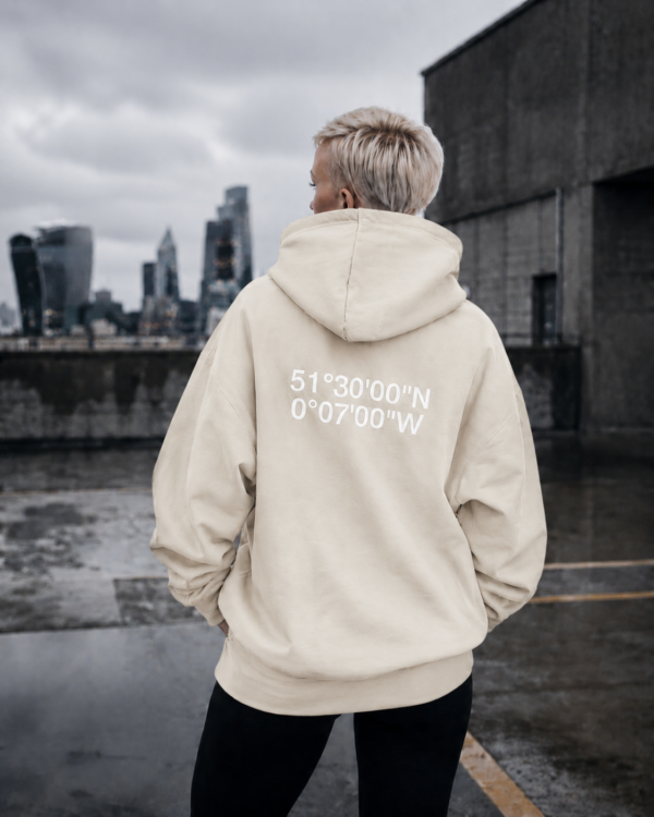 Natural Raw oversized London coordinates hoodie styled in an urban rooftop setting with cinematic concrete surroundings and relaxed oversized streetwear fit.