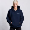 kk-hoodie-not-loud-just-powerful-front-logo-french-navy Front view of oversized French navy minimalist hoodie with small white “NOT LOUD JUST POWERFUL” chest logo, premium heavyweight fabric, kangaroo pocket, and relaxed oversized silhouette in a modern studio setting.