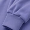 Close-up of violet hoodie sleeve cuff showing ribbed fabric texture and heavyweight material detail.