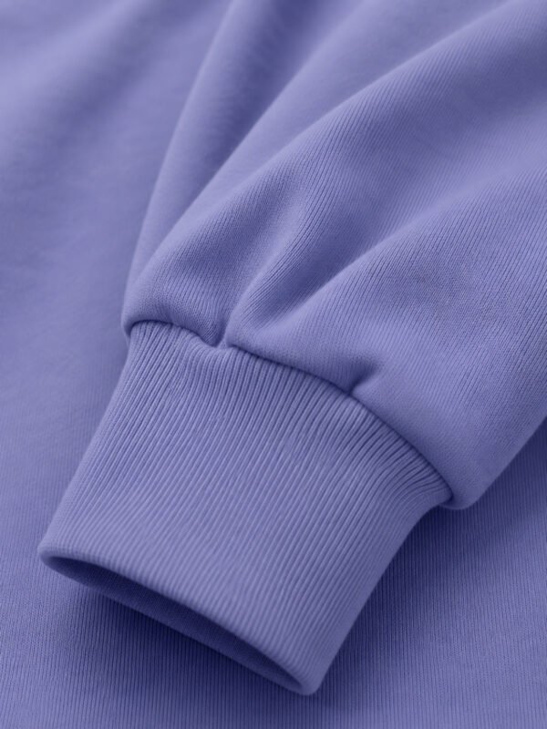 Close-up of violet hoodie sleeve cuff showing ribbed fabric texture and heavyweight material detail.