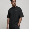 kk-tee-bristol-black-front-logo Model wearing a black oversized Bristol T-shirt featuring a minimal Bristol logo printed on the left chest in a clean streetwear style.