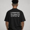 Waist-up rear view of a black Liverpool coordinates T-shirt featuring large city name and coordinate print across the back.
