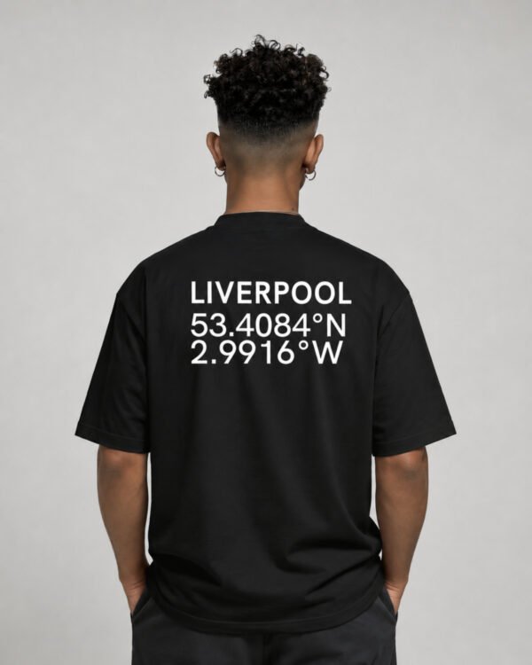 Waist-up rear view of a black Liverpool coordinates T-shirt featuring large city name and coordinate print across the back.