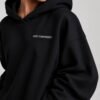Close-up of the Kat Krush oversized black heavyweight hoodie showcasing the "Quiet Confidence." chest print, premium heavyweight fabric and dropped shoulder construction.