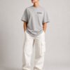 "Heather Grey oversized Kat Krush London coordinates t-shirt with black chest logo. Relaxed heavyweight streetwear fit styled with off-white cargo trousers."