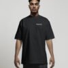 Front view of a male model wearing a black Bristol Signature oversized heavyweight T-shirt featuring a minimalist white left chest coordinates print.