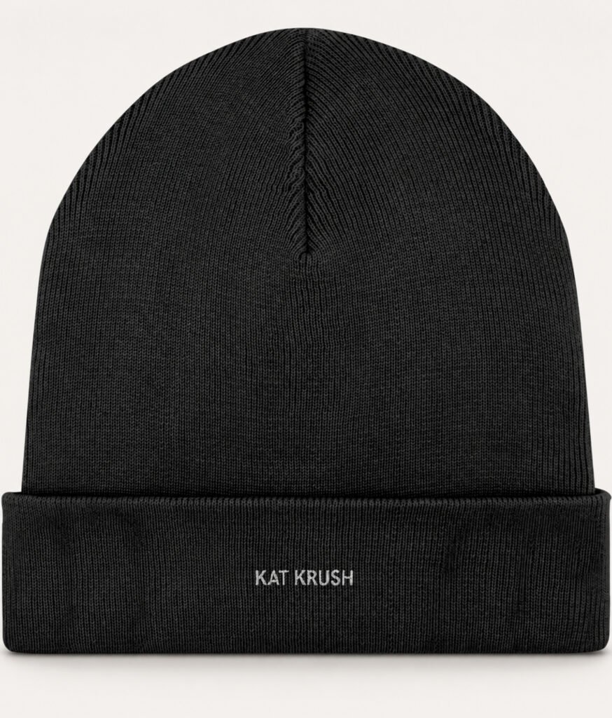 Black Kat Krush fine rib-knit beanie with a folded cuff and small white embroidered logo.